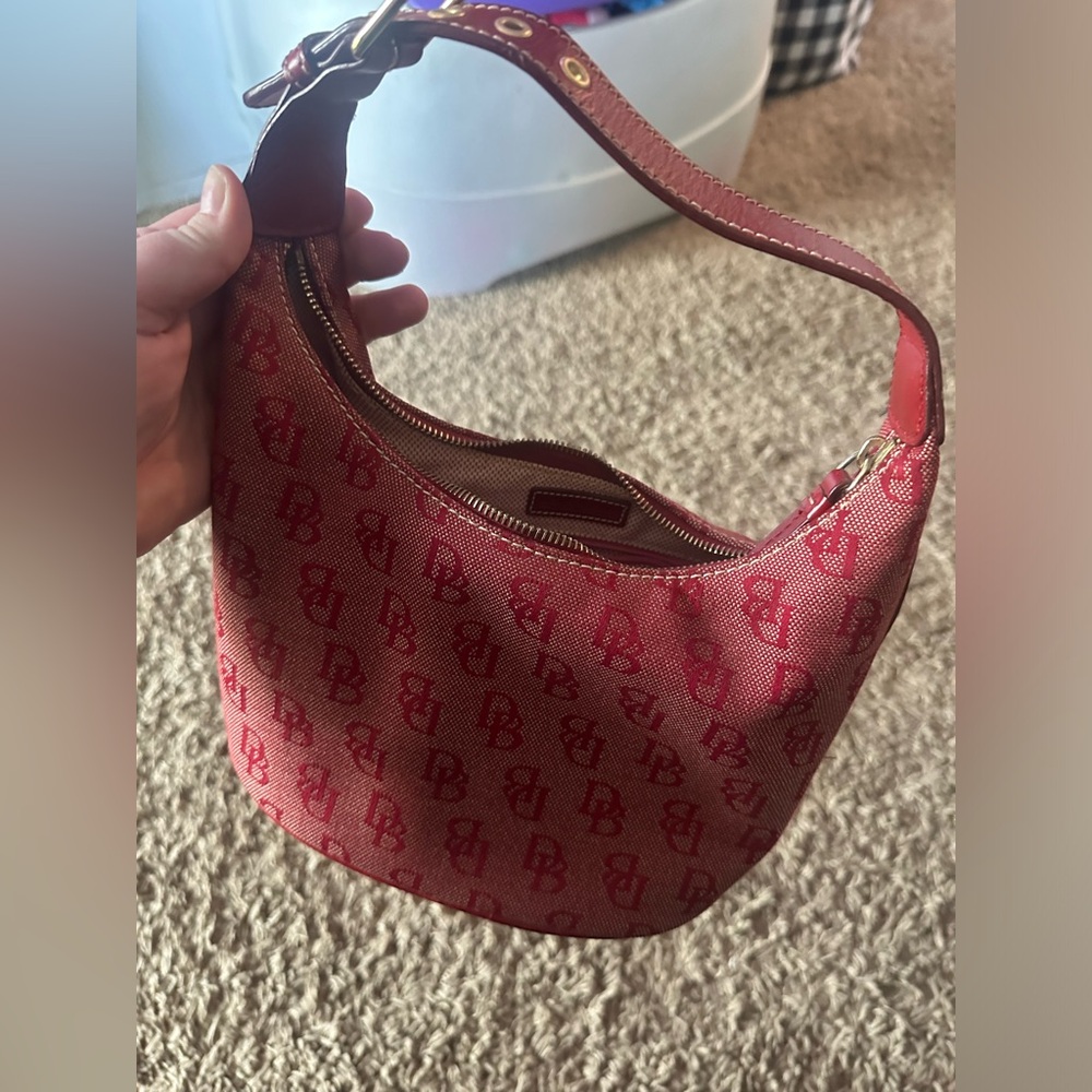 Red signature Dooney and Bourke purse.